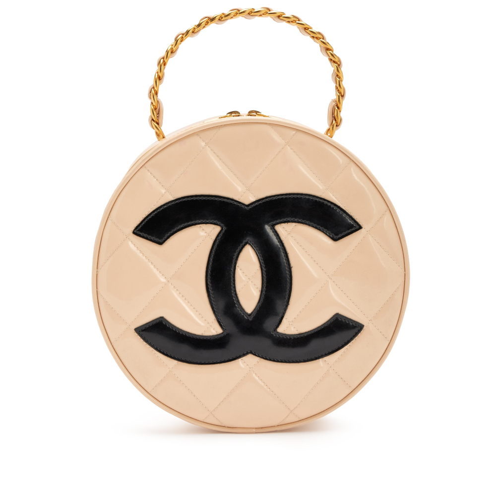 Chanel

Vintage Beige and Black Patent Leather Round Vanity Bag Aged Gold Hardware, 1994-1996