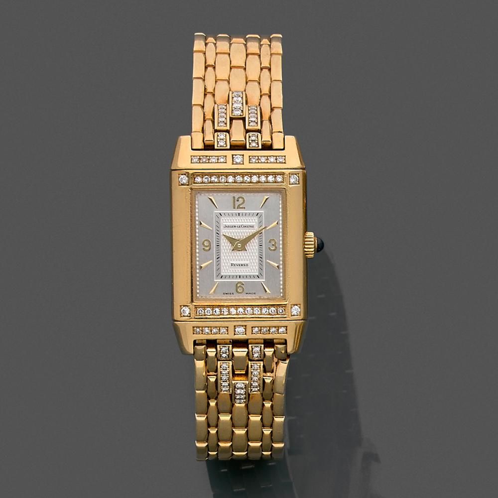 JAEGER LECOULTRE REVERSO LADY. REF. 265.1.86 A gold and diamond quartz reversible lady's watch by Jaeger Lecoultre, circa 2000.