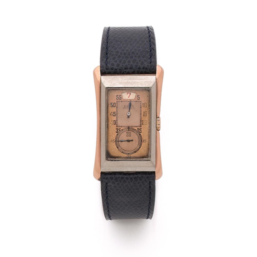 ROLEX PRINCE BRANCARD “JUMP HOURS” REF. 1491. A pink and white (9k) gold Jump Hours manual winding wristwatch by Rolex, from the 3...