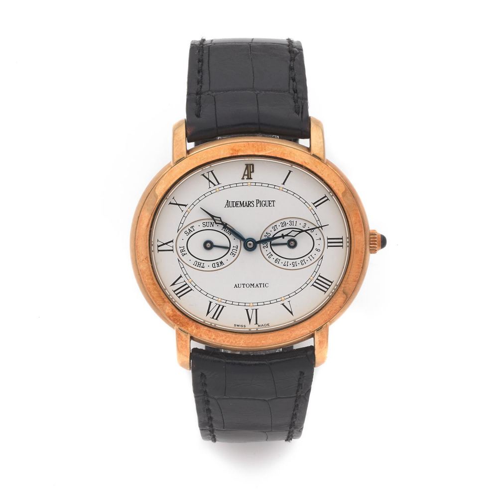 AUDEMARS PIGUET MILLENARY DAY-DATE. REF. 25779BA. A gold double calendar self winding wristwatch by Audemars Piguet, from the 2000's...